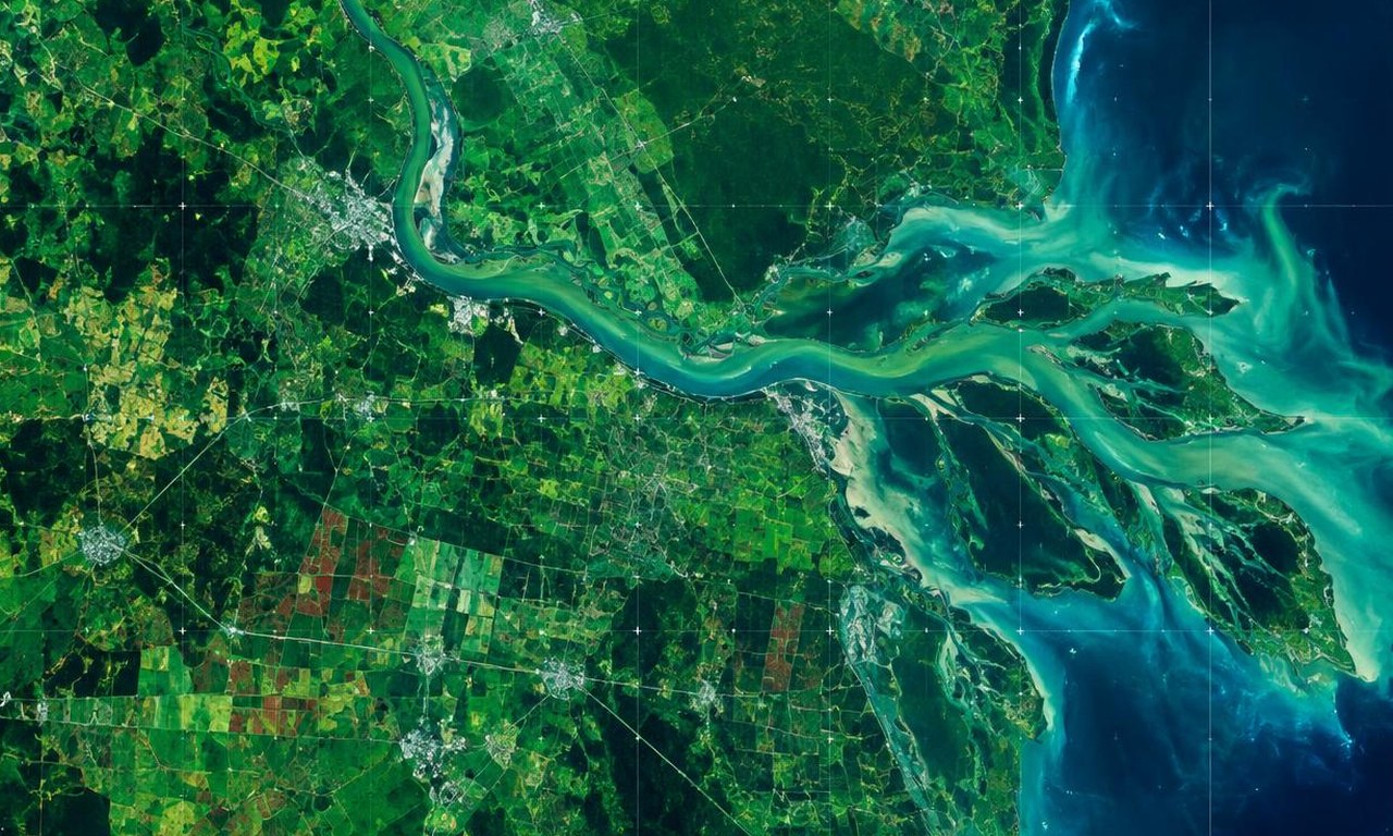 Satellite earth observation view of farmland, rivers and coastline